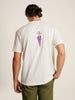 Man in white t-shirt with purple flower, Picasso design, back view.
