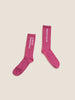 Two pairs of pink 'love' and 'love' socks by DISCO BASTARD SOCKS.